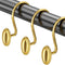 Gold curtain hooks on a gray rod against a white background