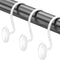 White curtain hooks on a black curtain rod against a white background