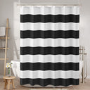 Black and white striped shower curtain in a bathroom setting.