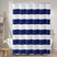 Navy and white striped shower curtain in a bathroom setting.