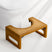 Wooden bathtub stool on a white background