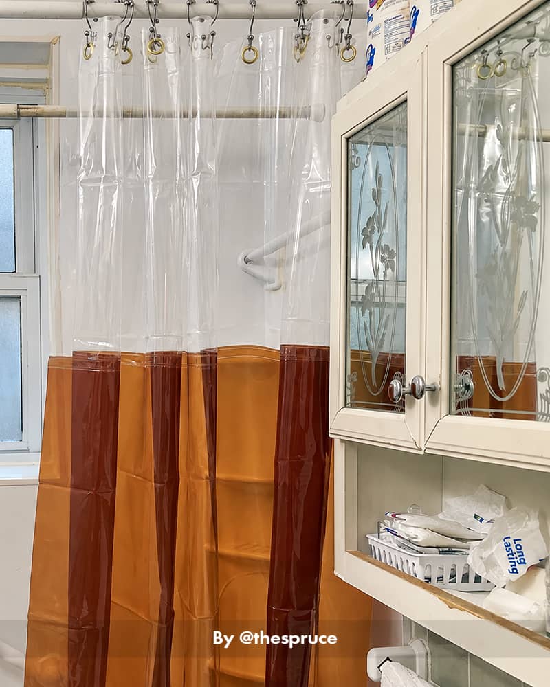 AmazerBath amber color-block Sun EVA shower curtain liner displayed beside a bathroom vanity and mirrored cabinet.