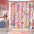 A shower curtain featuring an abstract geometric pattern with black lines on a white background, displayed in a bathroom setting.