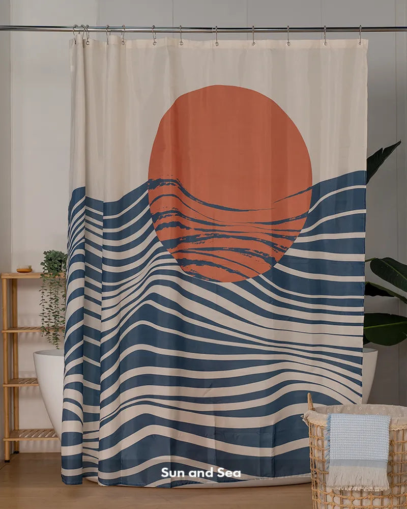 Customer bathroom photo showing a boho Sun and Sea shower curtain with 12 rings, displayed as a complete curtain set.