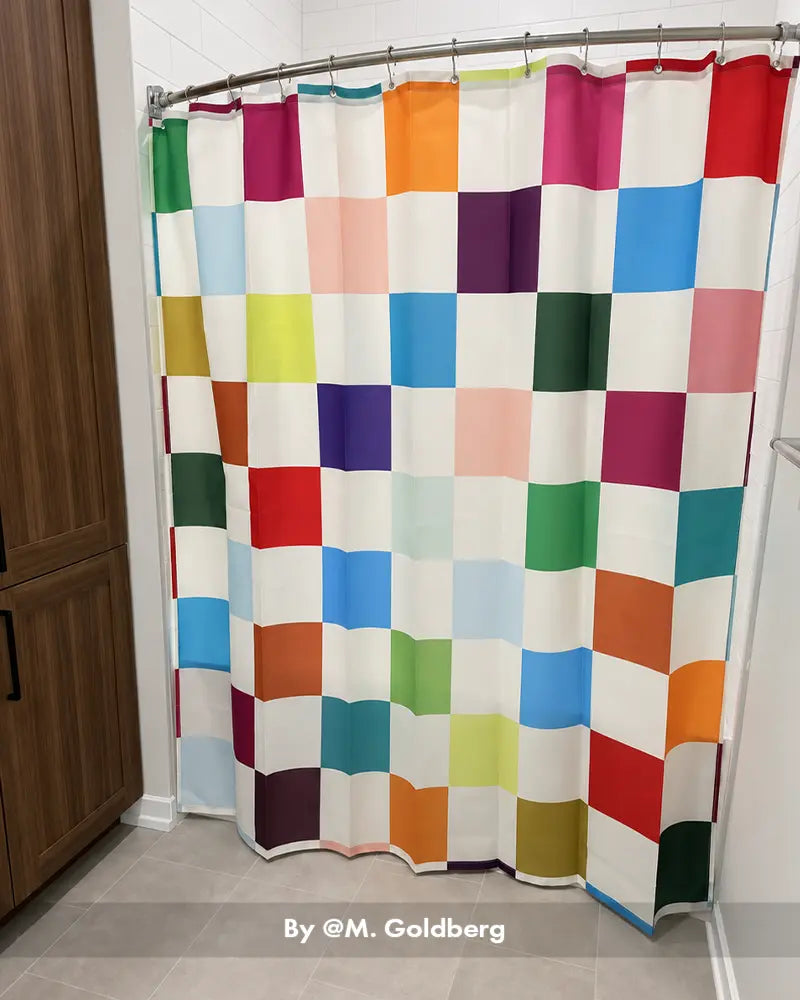 AmazerBath colorful checkerboard shower curtain with 12 rings adding a bold geometric accent to a home bathroom.