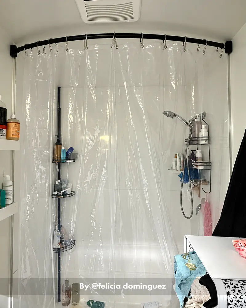Customer bathroom photo showing a curved shower curtain rod installed above a tub, with the curved shape visible.