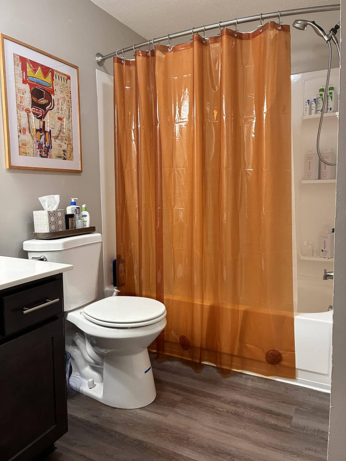 Orange shower curtain in a bathroom