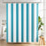 Striped shower curtain with blue and white vertical stripes in a bathroom setting.