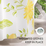 Shower curtain with floral design and text 'Weighted stones keep in place' on a neutral background
