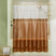 Clear shower curtain with brown pattern in a bathroom setting