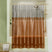 Clear shower curtain with brown gradient in a bathroom setting