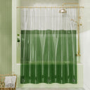 Green shower curtain with gold fixtures in a bathroom setting