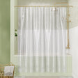 Shower curtain with gold fixtures in a bathroom setting