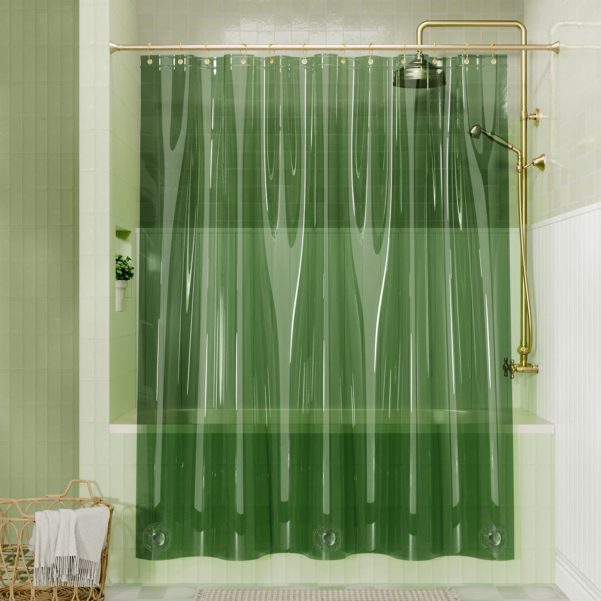 Green shower curtain in a bathroom with gold fixtures