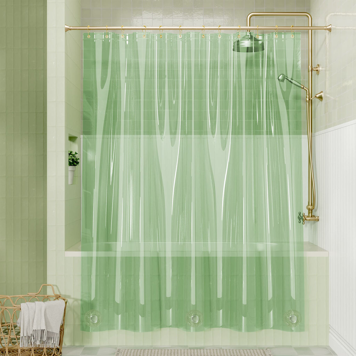 Green shower curtain with gold fixtures in a bathroom setting