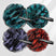 Four bath poufs in green, red, blue, and black with 'nazerBath' branding on a white background.
