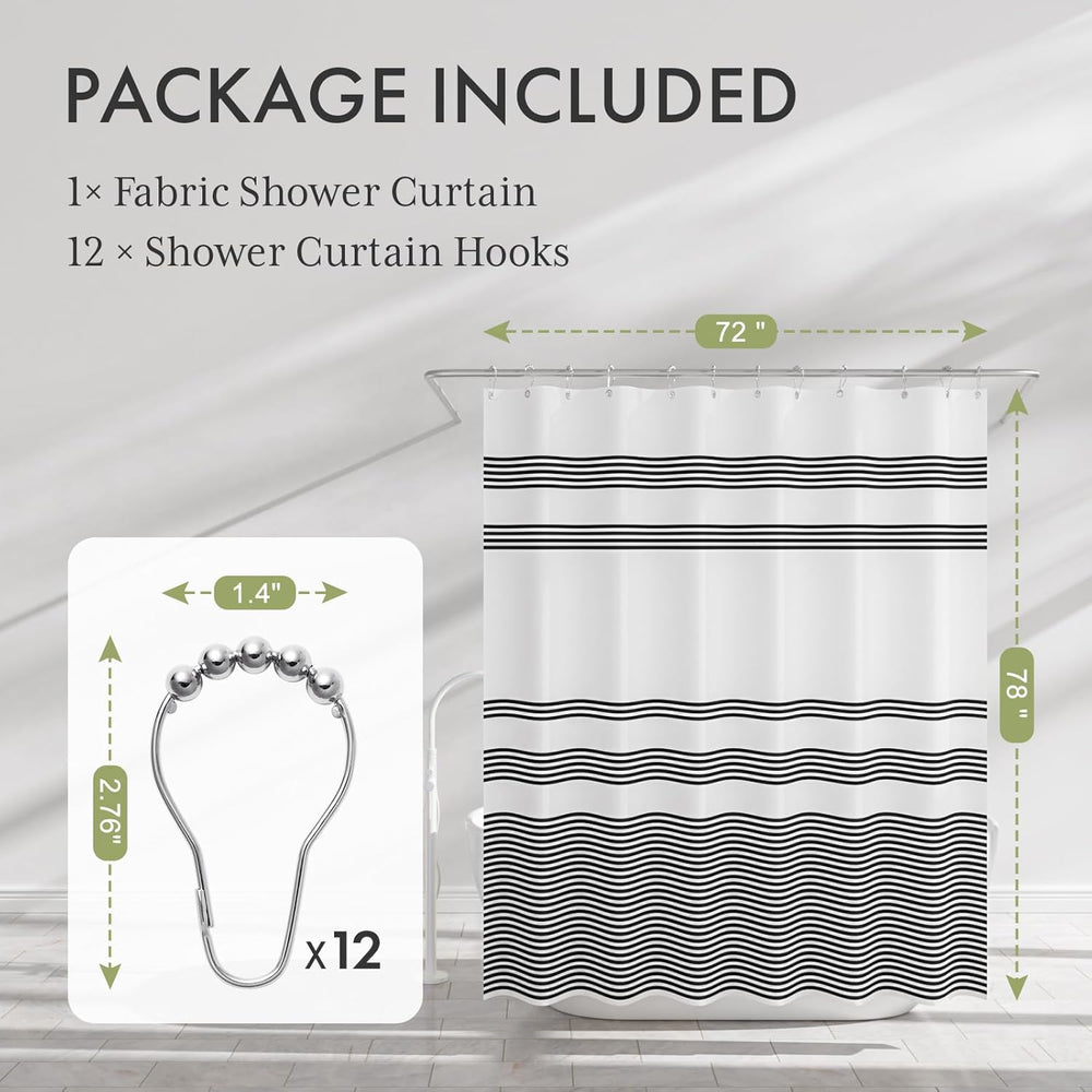 Fabric shower curtain with black wavy pattern and shower curtain hooks on a gray background