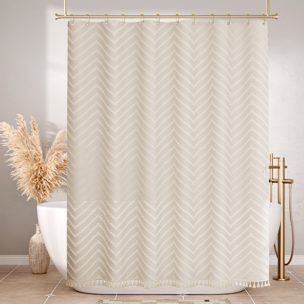 Beige chevron patterned shower curtain in a bathroom setting with gold fixtures.