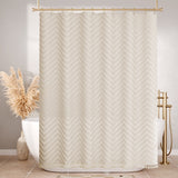 Beige chevron patterned shower curtain in a bathroom setting with gold fixtures.