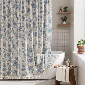 Bathroom with a floral shower curtain, bathtub, and wooden stool.