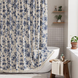 Floral shower curtain with blue flowers on a white background in a bathroom setting.