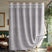 Gray shower curtain with decorative top trim in a bathroom setting.