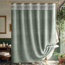 Green farmhouse shower curtain with decorative top trim in a bathroom setting