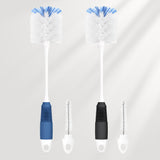 Two bottle cleaning brushes with blue bristle heads on a light gray background