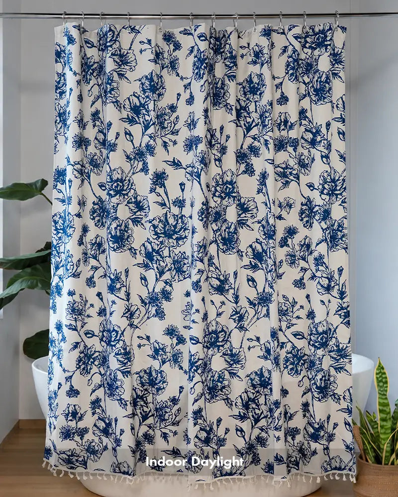 AmazerBath dark blue floral tassel shower curtain with botanical print hanging beside a white bathtub indoors.