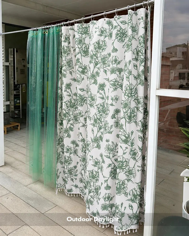 AmazerBath green floral tassel shower curtain shown outdoors with botanical print, color-block panel, and fringe.
