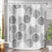 Shower curtain with geometric circle pattern in a bathroom setting