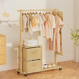 Wooden clothing rack with hangers and drawers in a room setting