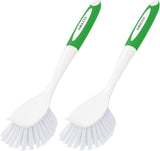 Two white barbecue cleaning brushes with green handles on a white background