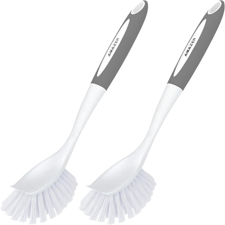 Two kitchen cleaning brushes with gray handles and white bristles on a white background.