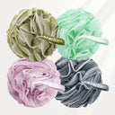 Four bath poufs in green, pink, gray, and mint with 'amazerBath' branding on a white background.