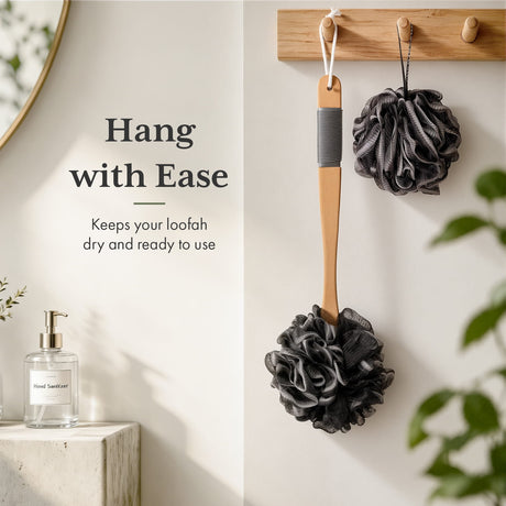 Black loofah hanging on a wooden hook with text 'Hang with Ease' on a light background.
