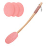 Pink silicone scrubber with wooden handle and three additional pink pads on a white background