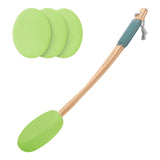 Spatula with green silicone heads on a white background