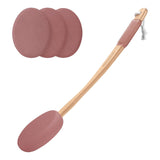 Pink silicone scrubber with wooden handle and three additional pads on a white background