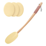Set of three yellow sponges and a wooden tool with a comb on a white background