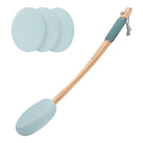 Cleaning tool with a wooden handle and three interchangeable silicone pads on a white background