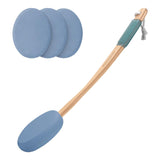Cleaning tool with blue silicone pads and wooden handle on a white background
