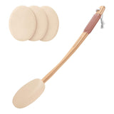 Set of three beige sponges and a wooden paddle with a comb on a white background