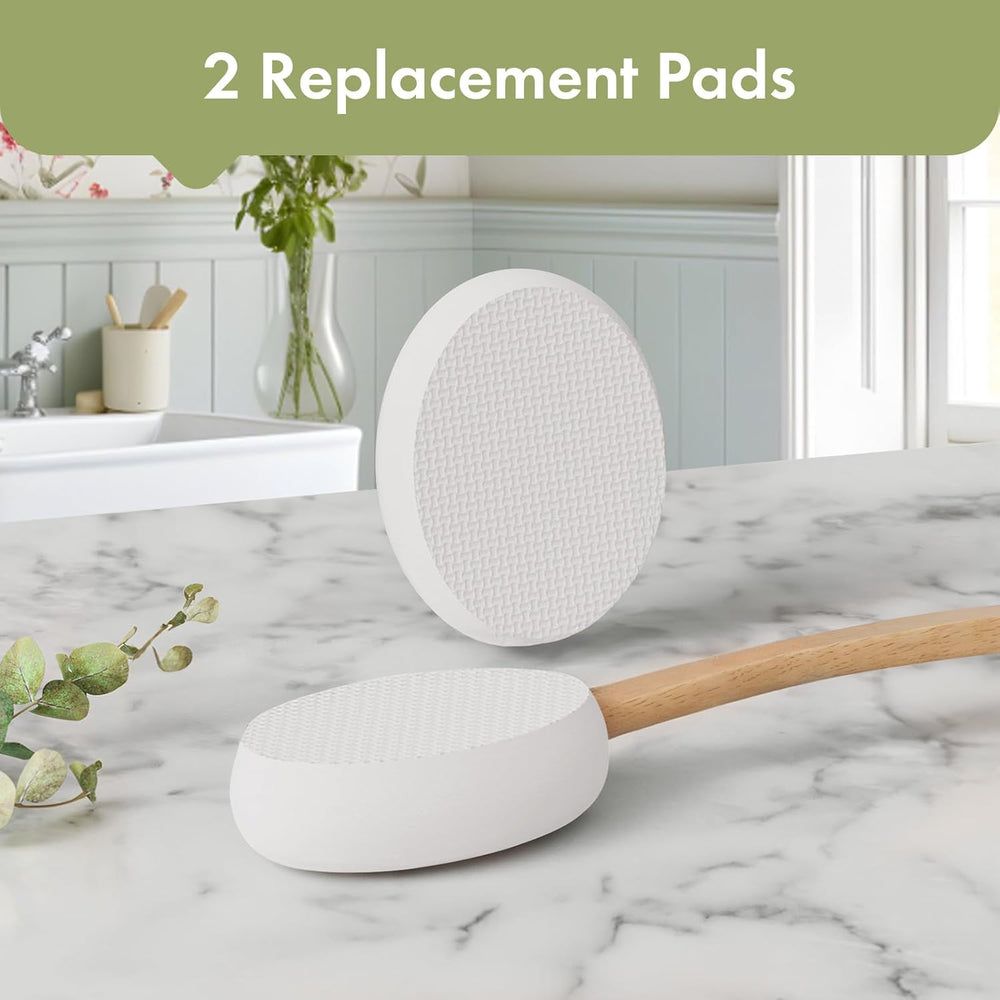 Two replacement pads on a marble surface with a kitchen background
