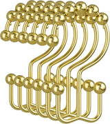 Set of gold hooks on a white background