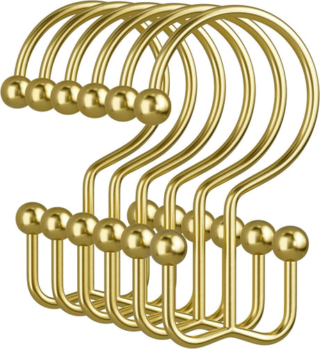 Set of gold hooks on a white background