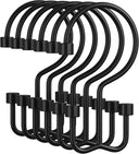 Set of black metal hooks on a white background