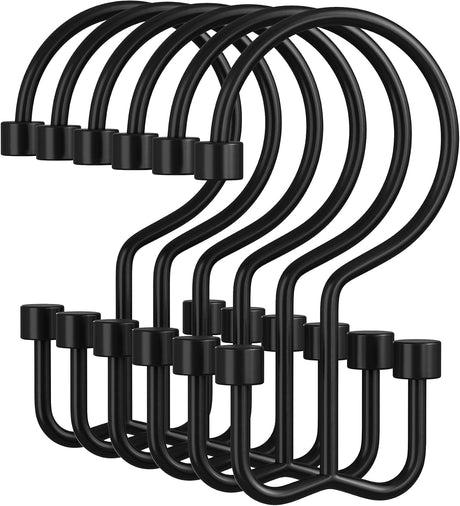 Set of black metal hooks on a white background