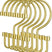 Set of gold hooks on a white background