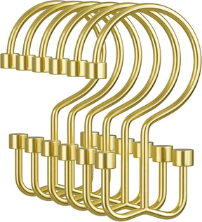 Set of gold hooks on a white background